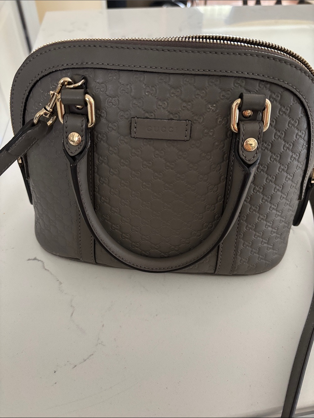 Gucci Gray GG Embossed Mini Dome Crossbody Bag with Gold Hardware